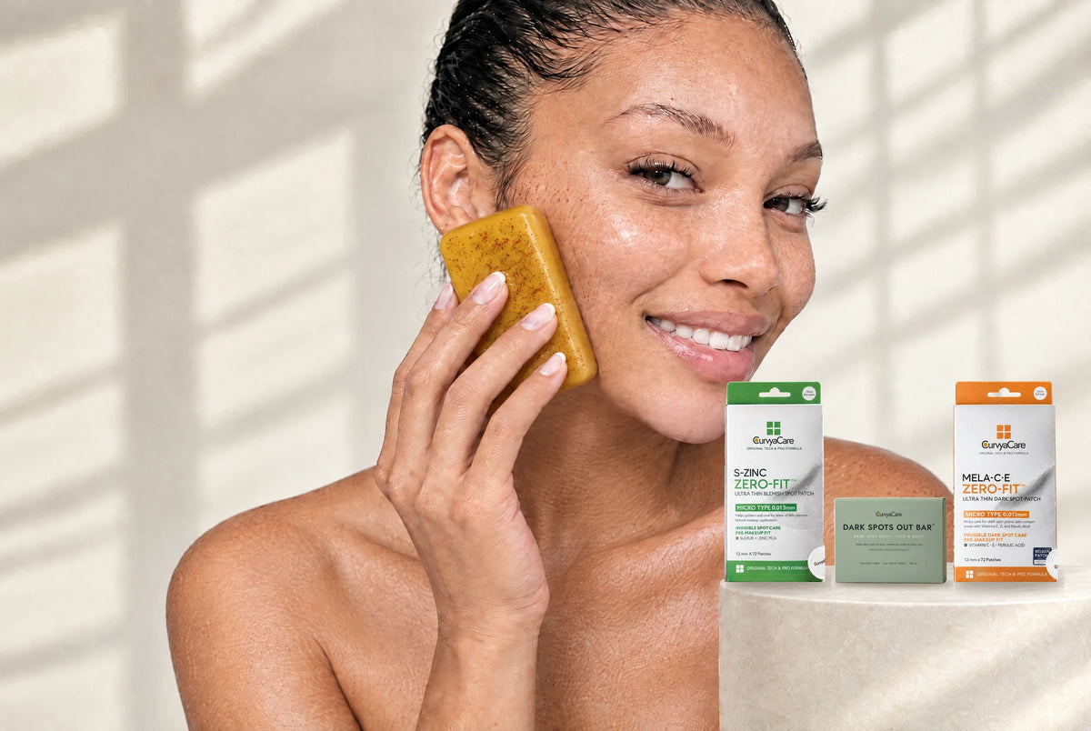 Woman holding the turmeric soap bar next to the Dark Spots Out Bar box and S-ZINC and MELA-C·E patch boxes